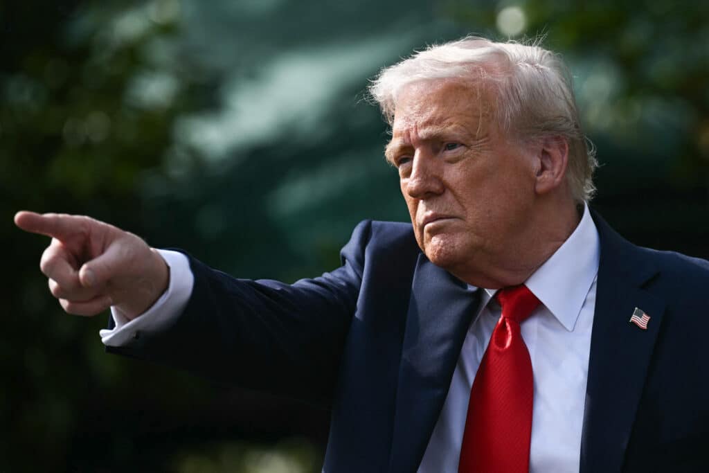 US President Donald Trump gestures after hosting the 2025 College Football National Champions, Ohio State Buckeyes, celebrating the team's title-winning season with a ceremony on the South Lawn of the White House in Washington, DC, April 14, 2025. (Photo by Brendan SMIALOWSKI / AFP) 