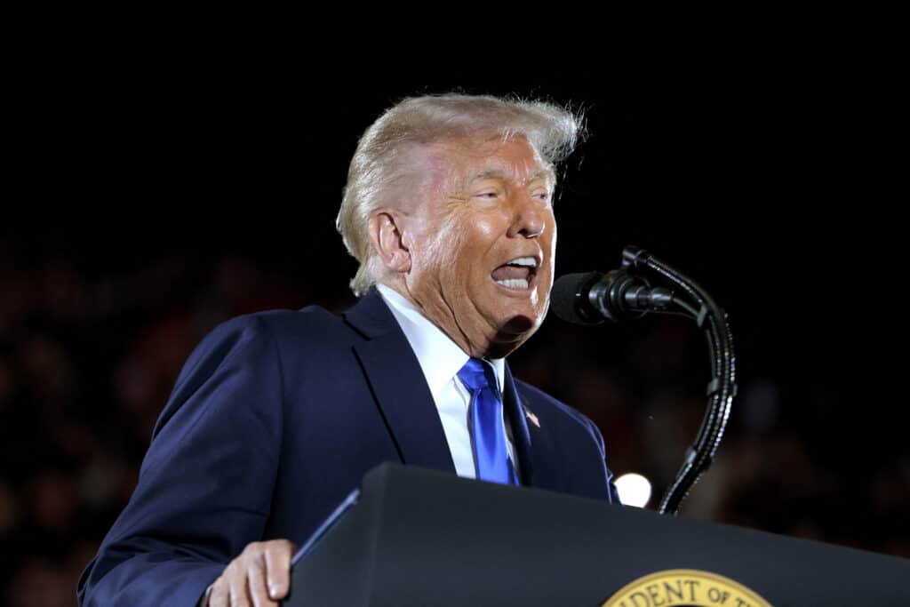 U.S. President Donald Trump delivers remarks to graduating students at the Coleman Coliseum at the University of Alabama on May 01, 2025 in Tuscaloosa, Alabama. Trump's remarks come the day before commencement ceremonies. | Anna Moneymaker/Getty Images/AFP