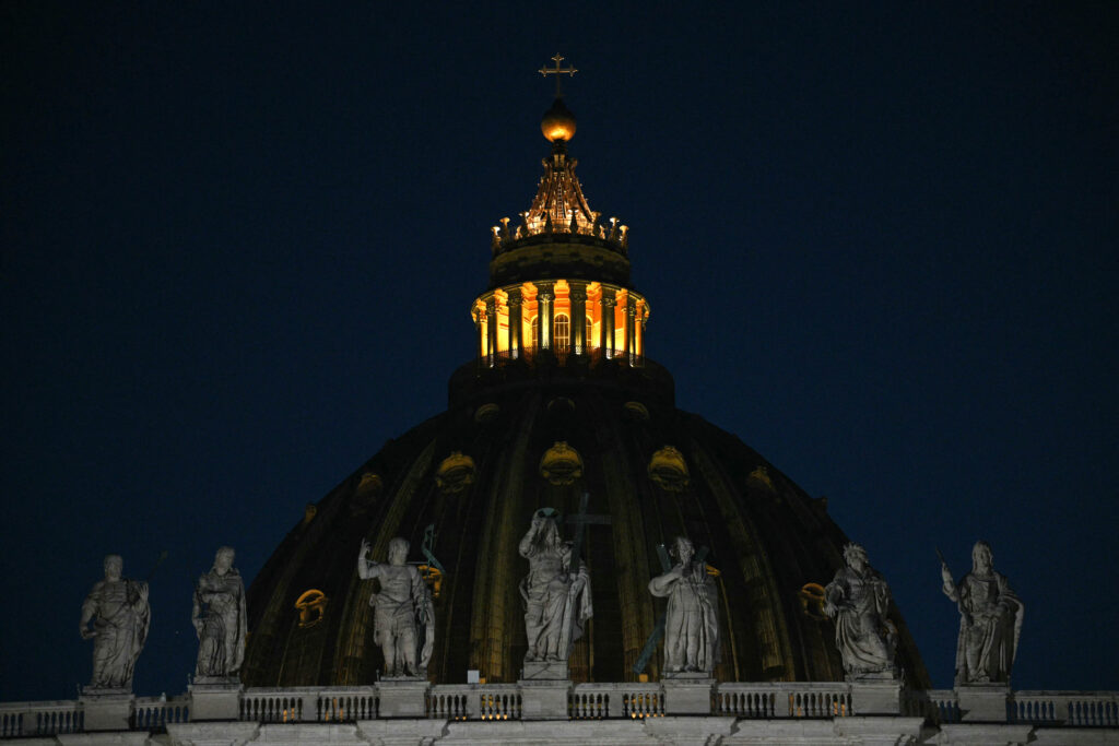 Conclave enters day 2: All eyes on Sistine Chapel chimney. A general view shows the cupola of St Peter's basilica at night during the conclave to elect a new Pope, in the Vatican on May 7, 2025. (Photo by Andreas SOLARO / AFP)